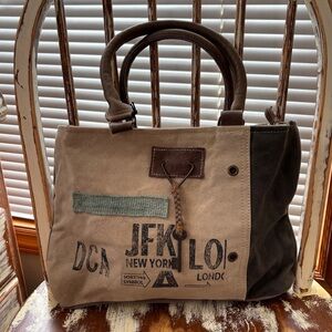THIS ITEM HAS SOLD!!!  Canvas and leather Travel Tote / purse NWT Myra Bag